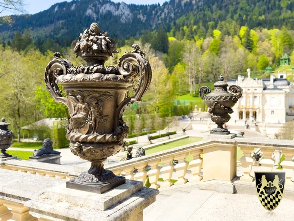 The magnificent gardens of Linderhof Palace with intricate designs and vibrant flowers.